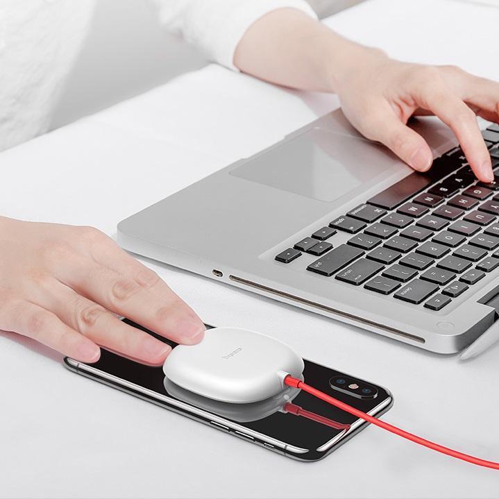 The charger, made of plastic and silicone is small,